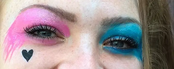 A Harley Quinn inspired design with pink and blue eyes