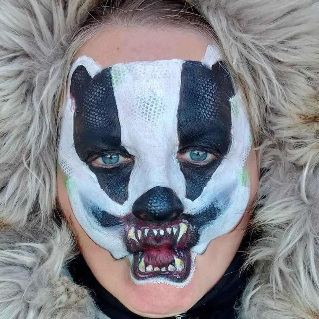Christine painted as a snarling badger, her own original design
