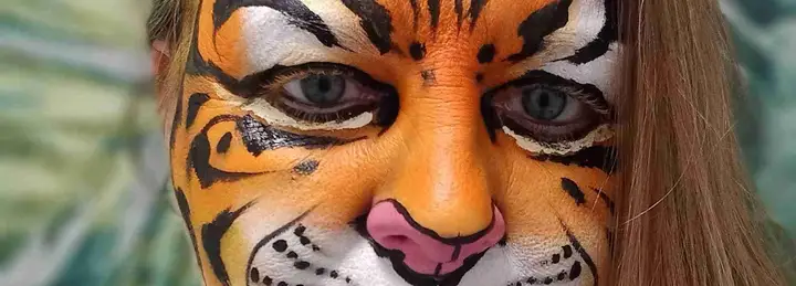 A colourful rainbow tiger face on a bright background